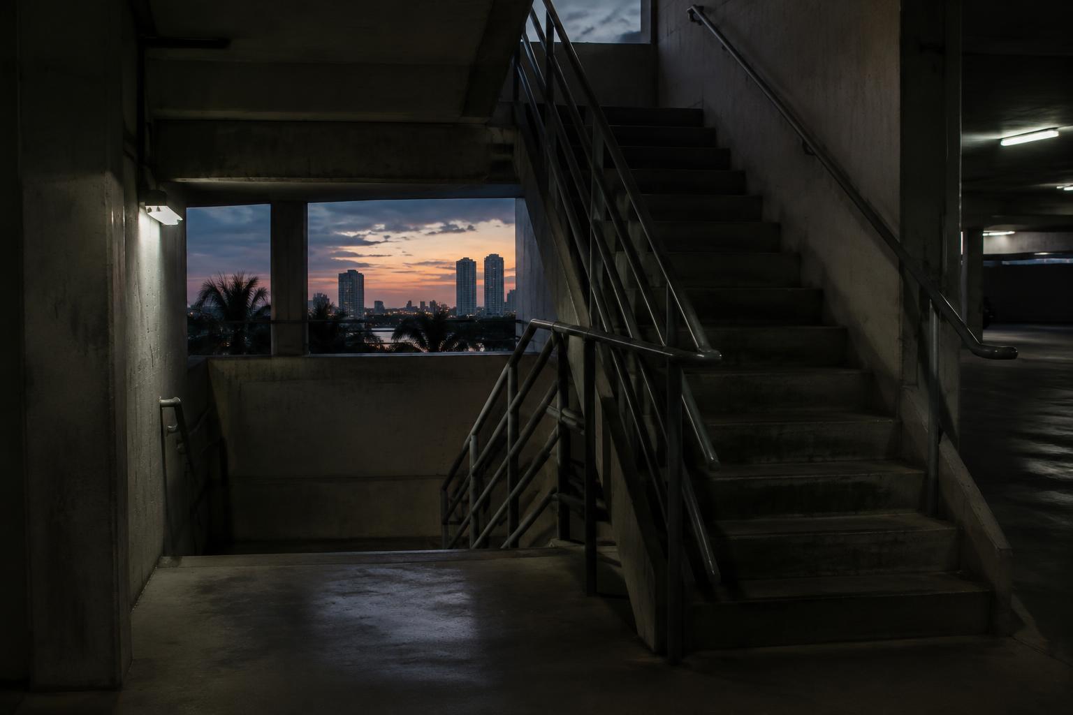 Dimly lit parking garage stairwell in Florida illustrating a negligent security claim scenario